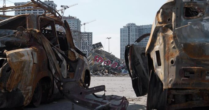 Cars burned by russian missile. Missile destroyed shopping and entertainment center Retroville in Kyiv city on March 20, 2022. Terror and genocide of Ukrainian people