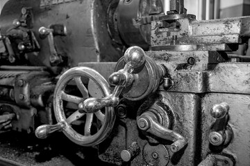  Metalworking workshop, metal processing machines.  Vintage Industrial Machinery in a old factory - black and white photo