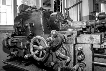  Metalworking workshop, metal processing machines.  Vintage Industrial Machinery in a old factory - black and white photo