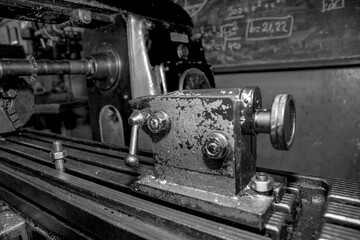  Metalworking workshop, metal processing machines.  Vintage Industrial Machinery in a old factory - black and white photo