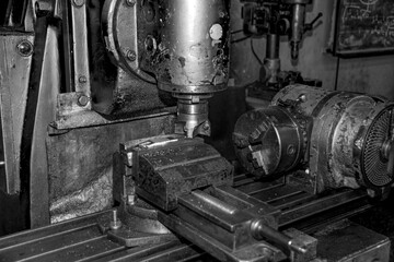  Metalworking workshop, metal processing machines.  Vintage Industrial Machinery in a old factory - black and white photo