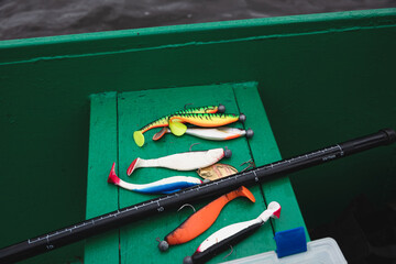Several fishing lures for catching pike on the bench of a fishing boat