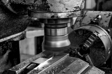  Metalworking workshop, metal processing machines.  Vintage Industrial Machinery in a old factory - black and white photo