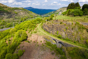 Fototapeta na wymiar Aerial view of an old tram road converted to a cycle route near the village of Clydach in South Wales