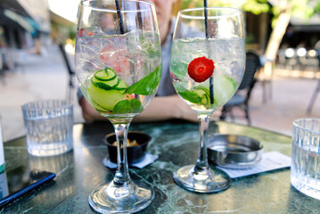Exotic cocktail with strawberries and mint in a greece restaurant. close up