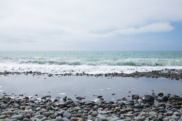 Sea stones background in the seaside on a beach.