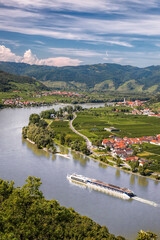 Panorama of Wachau valley (Unesco world heritage site) with ship on Danube river against Duernstein village in Lower Austria, Austria - 506949883