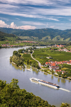 Panorama of Wachau valley (Unesco world heritage site) with ship on Danube river against Duernstein village in Lower Austria, Austria