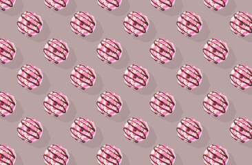 Pattern of pink donuts on red background