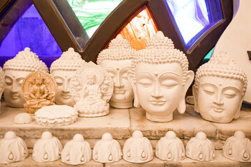 plaster buddha heads. sculpture. budism
