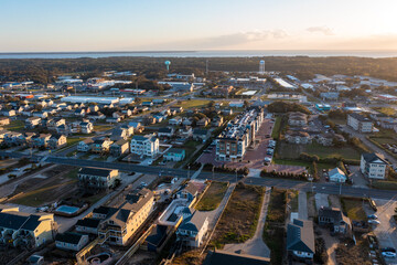 Aerial view of homes in Nags Head looking west during sunset and golden hour