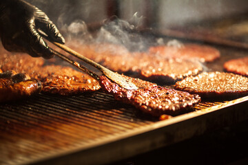 Chef Grilling Hamburgers on a Hot Plate