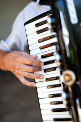 Accordionist hand playing the accordion