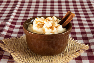 traditional sweet from the Brazilian June festivals, made of white corn with coconut and condensed milk and sprinkled with cinnamon