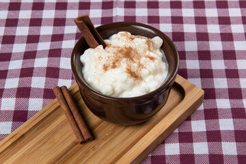 traditional sweet from the Brazilian June festivals, made of white corn with coconut and condensed milk and sprinkled with cinnamon