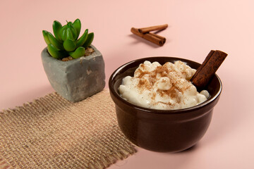 traditional sweet from the Brazilian June festivals, made of white corn with coconut and condensed milk and sprinkled with cinnamon