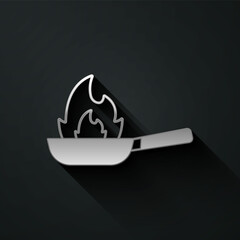 Silver Pan with fire icon isolated on black background. Long shadow style. Vector