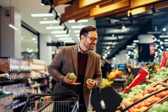 Young Man Shopping In A Grocery Store