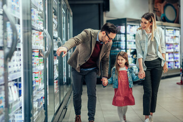 Family shopping at supermarket