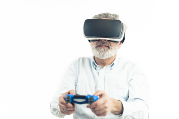 Caucasian middle-aged man with silver gray hair wearing Virtual Reality Googles and holding a blue Gamepad. Isolated on white. High quality photo