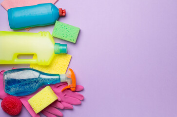 Many different house cleaning products on color background, top view
