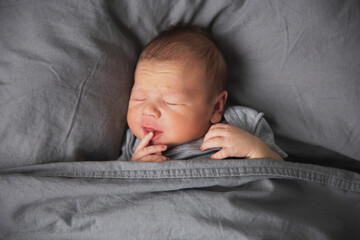 Portrait of a sleeping baby on a big pillow