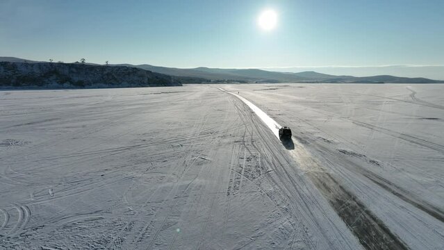 van over ice from aerial view
