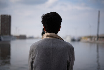 Fototapeta premium man looking out the sea