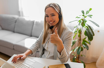 Young woman working in call center. Customer support woman in office