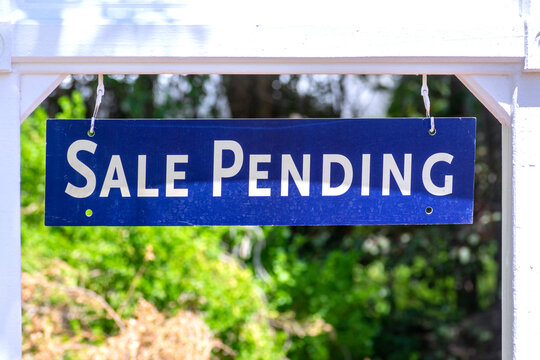 Sale Pending real estate sign near purchased house during red hot seller's market in the desired residential neighborhood