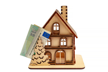Folded cash banknote of 5 euros and wooden toy symbolic house, white isolated background - Powered by Adobe
