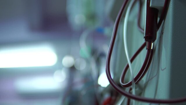 Close up doctor hand uses a dialysis machine for the patient