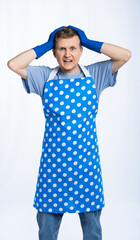man in blue apron, rubber gloves, blue t-shirt, jeans. housewife clutched her head, frightened....