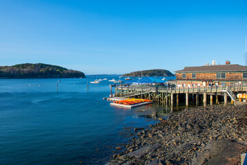 Bar Harbor Town Pier with Bar Island and Sheep Porcupine Island at the background in historic town...