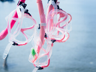Pink plastic diving masks are basic equipment for snorkelers. - 506986873