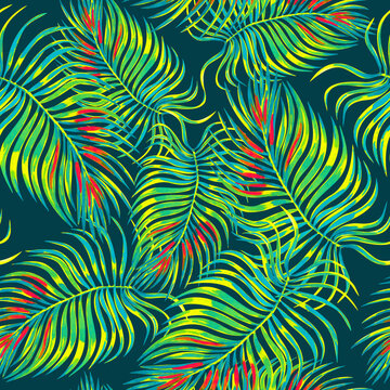 Tropical foliage seamless pattern. Watercolor palm leaves on dark blue background