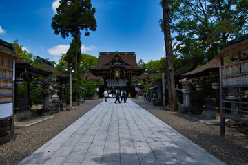 The shrine gate, approach and lantern of Kitano-tenmanguu.  Kyoto Japan
