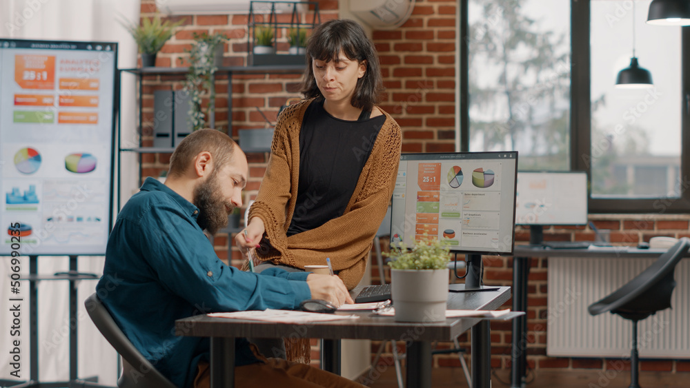 Poster man and woman brainstorming ideas to plan business project and design rate charts on computer for an