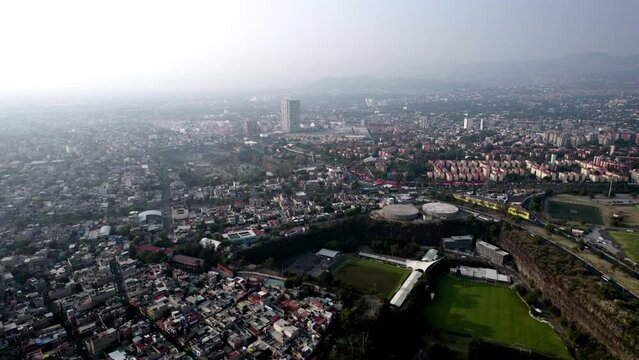 drone video of the unam quarry in mexico city during a day with highly polluted air