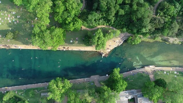 Aerial drone footage of people swimming at the Barton Springs Pool in Austin, Texas. Interesting fact, Robert Redford learned how to swim in this very pool when he was just 5 years old.