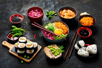 Assortment of Korean food on dark background.