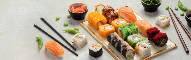Sushi assortment on light background.