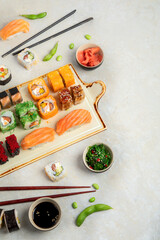 Sushi assortment on light background.
