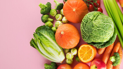 Assortment of vegetables and fruits on colorful background.