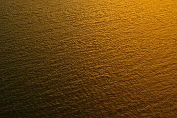 The golden sea and wave before sunrise.