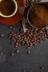 coffee in a cup, coffee grains and all types of coffee, photo from above on a dark background with space for text