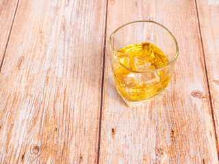 glass for liquor Translucent elements made of glass are placed on a wooden table. 