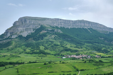Obraz premium Torrano small town in the Ergoyena Valley at the foot of the Sierra de San Donato surrounded by large meadows. rural tourism. Navarre, Spain