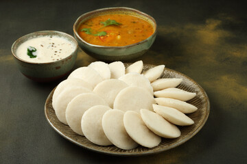 Idly sambar or Idli with Sambhar and green, red chutney. Popular South indian breakfast