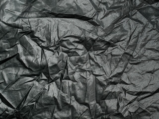 Crumpled cloth texture closeup background.